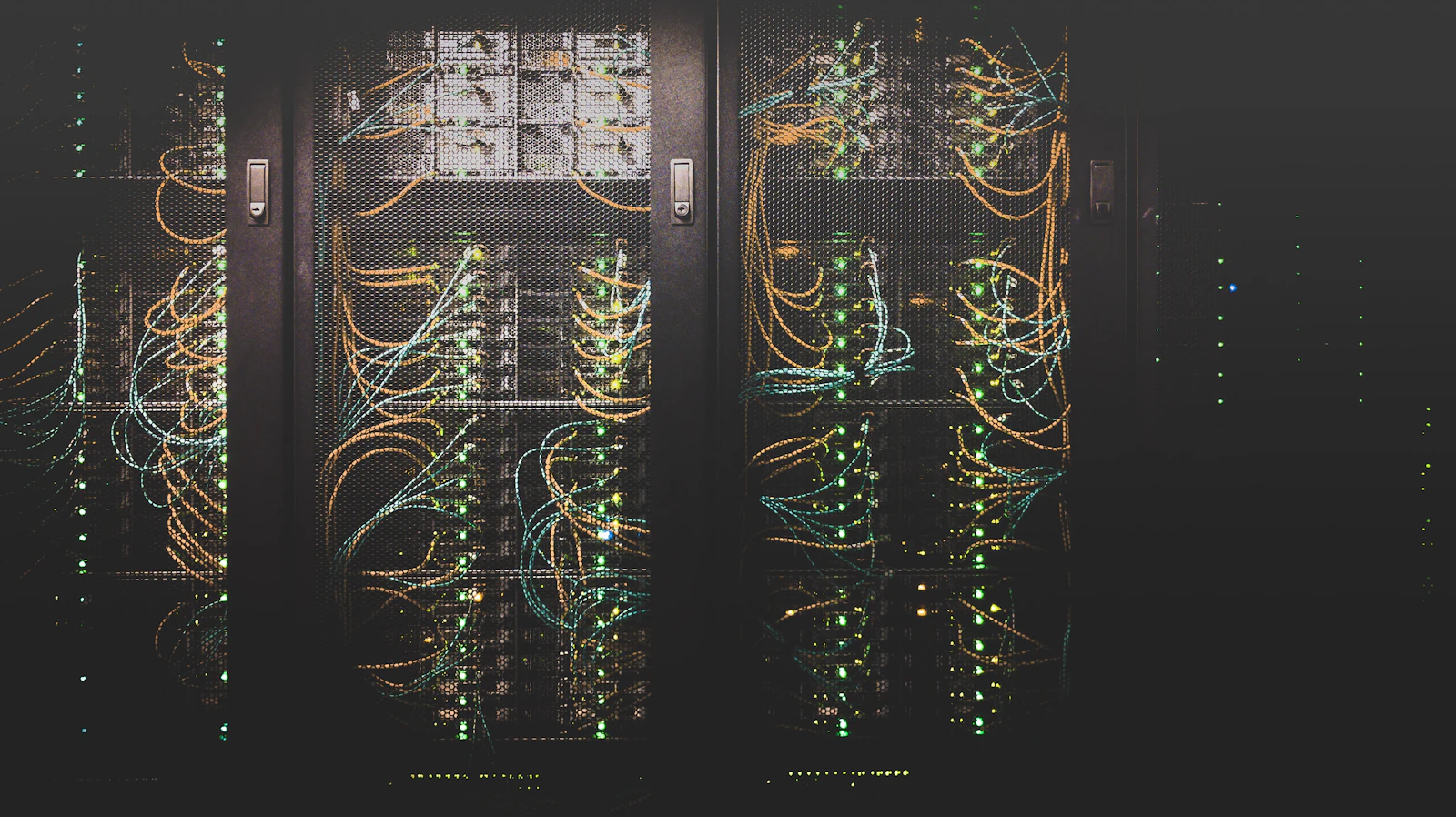 Rows of connected network cables inside a data centre